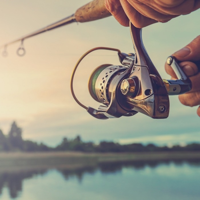 Person casting a fishing rod